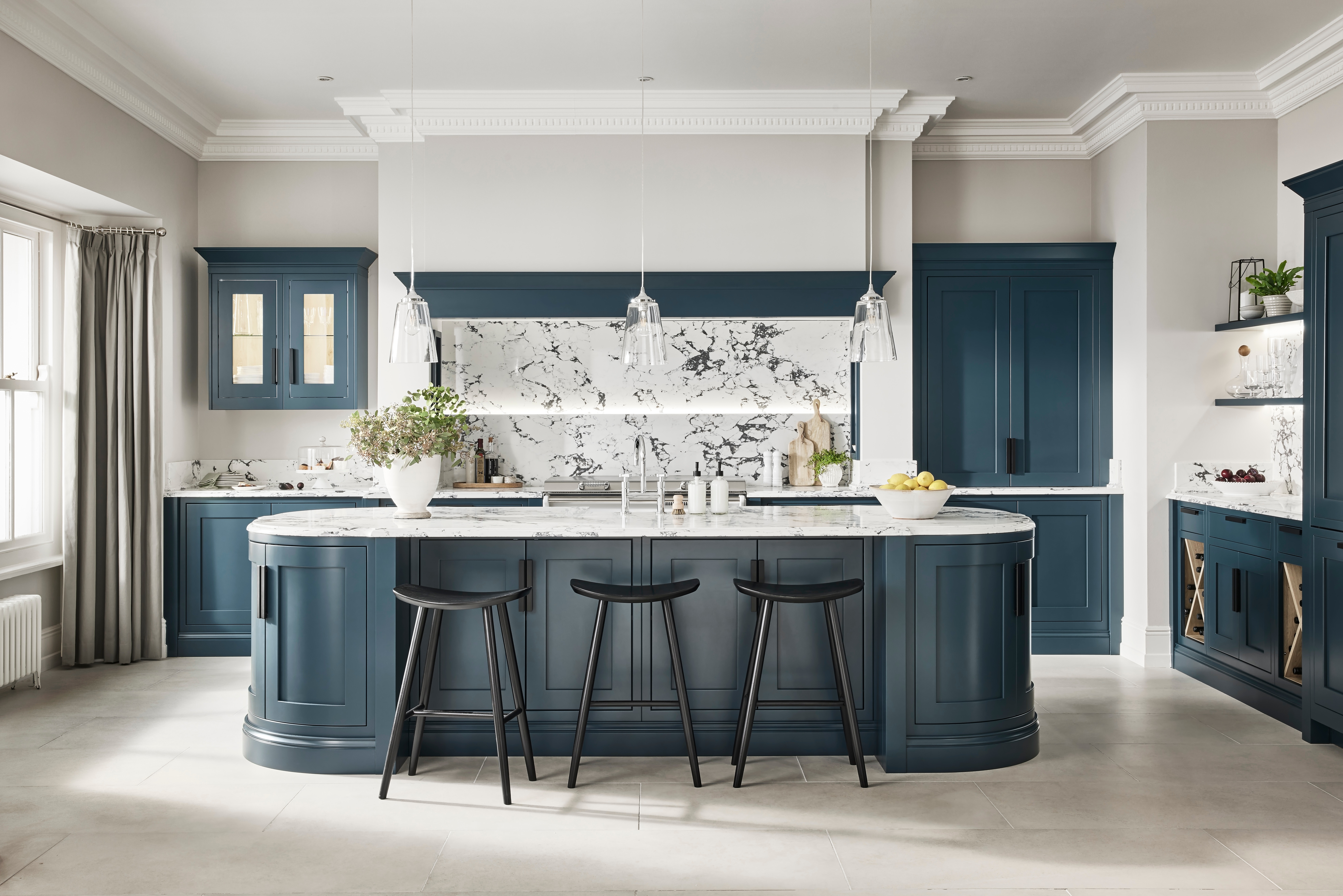 Kitchen with curved cabinetry and an island